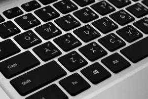 AI translation for WordPress: Arabic keyboard on a laptop for multilingual WordPress sites