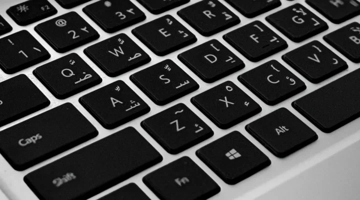 AI translation for WordPress: Arabic keyboard on a laptop for multilingual WordPress sites