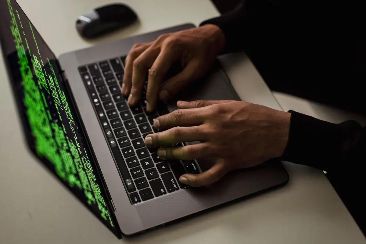 Hands typing on a laptop while running a WordPress security audit